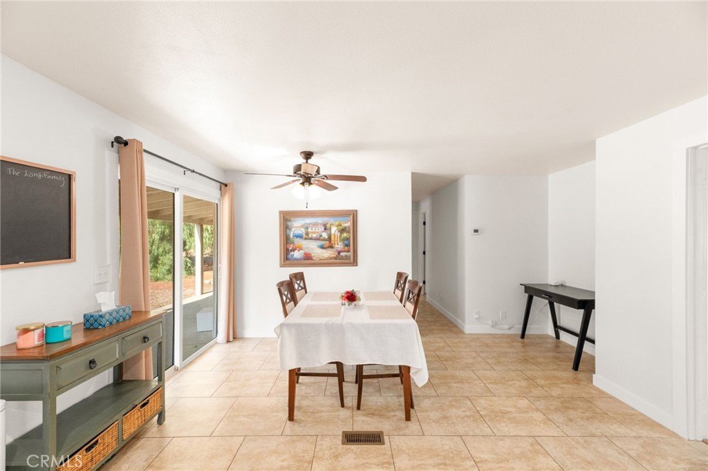 33653 Windmill Road Wildomar, CA 92595 - Photo 33 of 66 a living room with furniture and a flat screen tv