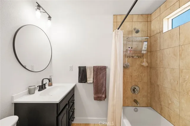 a bathroom with a glass shower door
