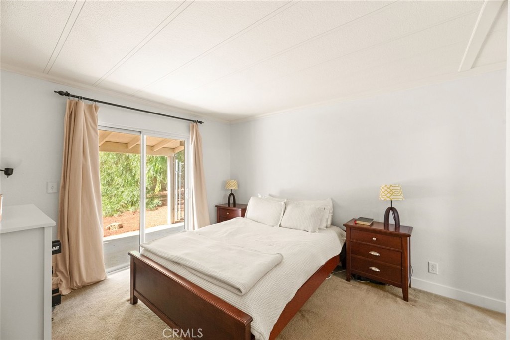 33653 Windmill Road Wildomar, CA 92595 - Photo 40 of 66 a bedroom with a bed and a window