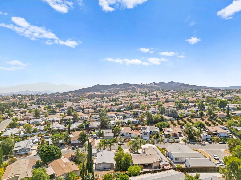 33653 Windmill Road Wildomar, CA 92595 - Photo 57 of 66 an aerial view of residential houses with outdoor space and parking