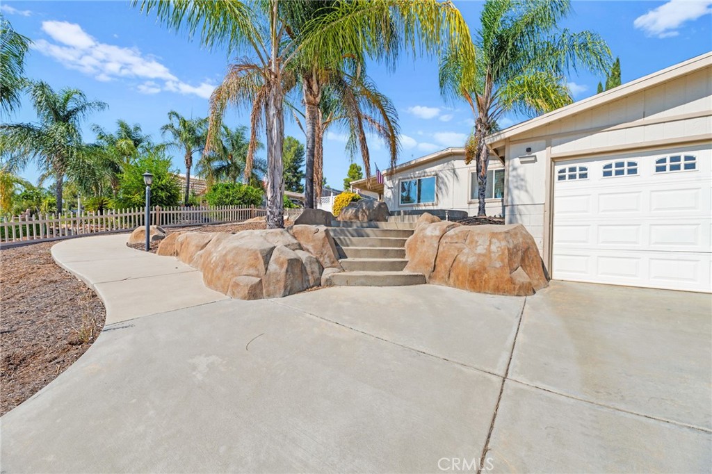 33653 Windmill Road Wildomar, CA 92595 - Photo 6 of 66 a view of a backyard with a patio