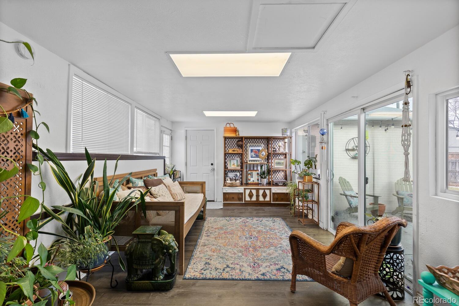 3106 South Wolff Street Denver, CO 80236 - Photo 15 of 48 a living room with furniture and a potted plant