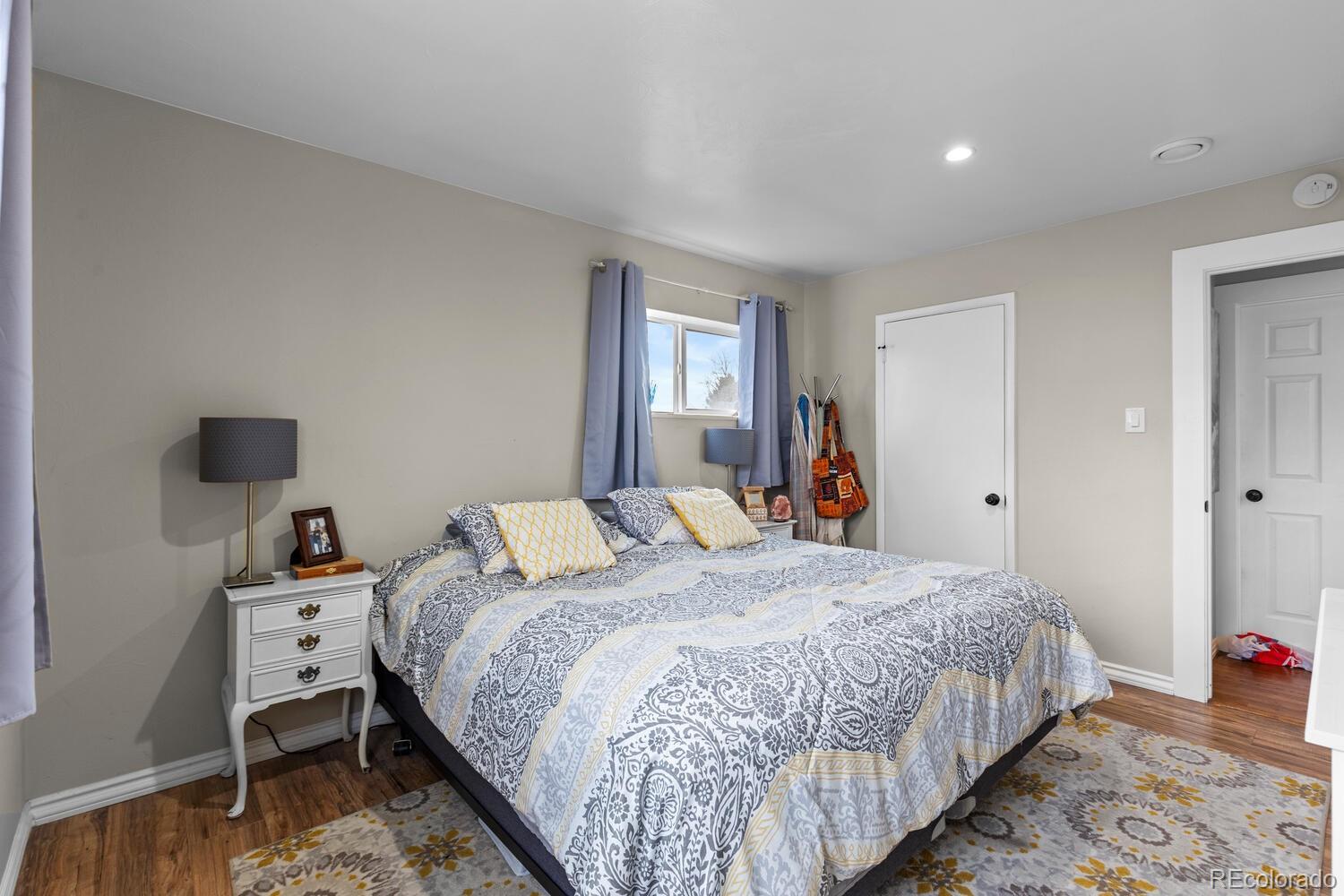 3106 South Wolff Street Denver, CO 80236 - Photo 18 of 48 a bedroom with a bed and a window