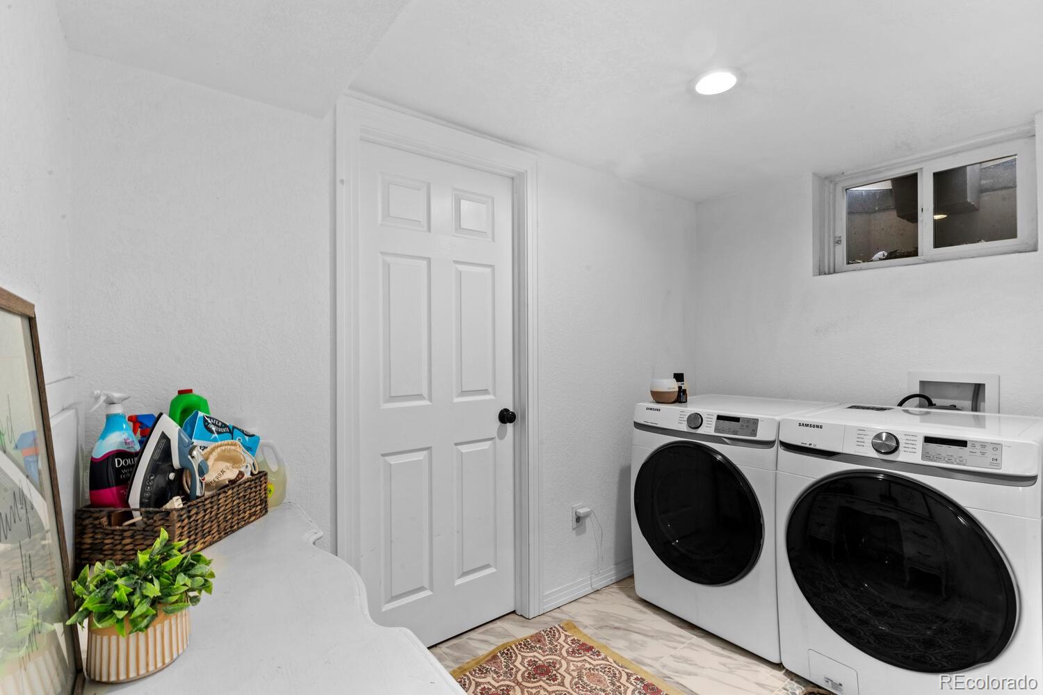 3106 South Wolff Street Denver, CO 80236 - Photo 25 of 48 a utility room with dryer and washer
