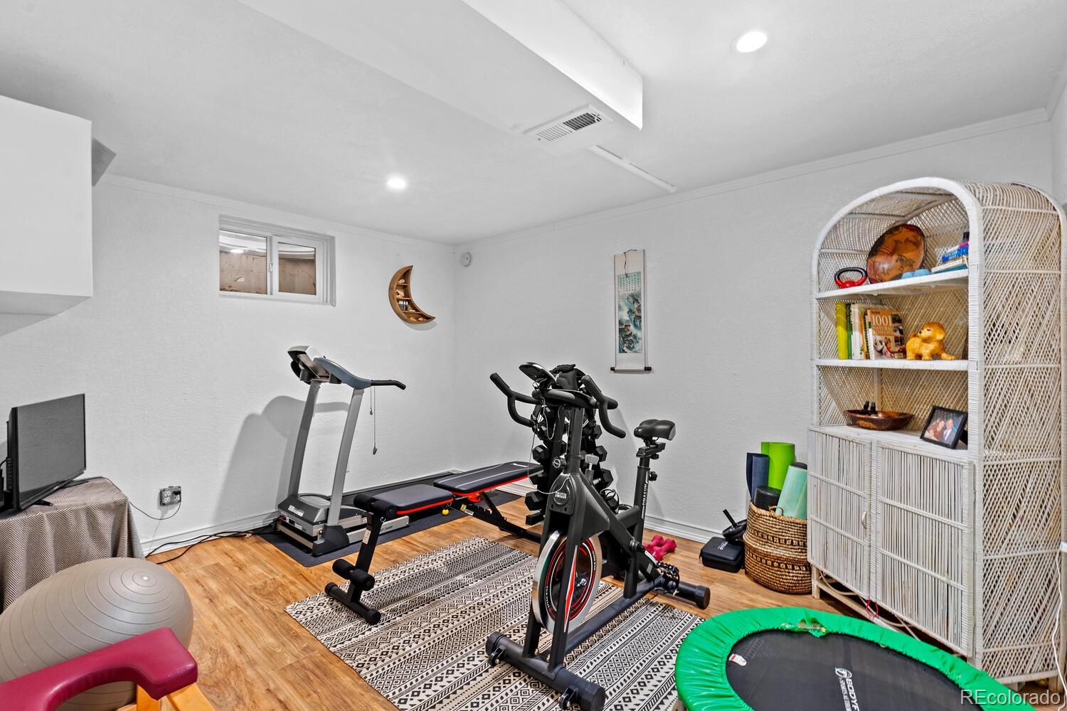 3106 South Wolff Street Denver, CO 80236 - Photo 28 of 48 a view of a room with gym equipment