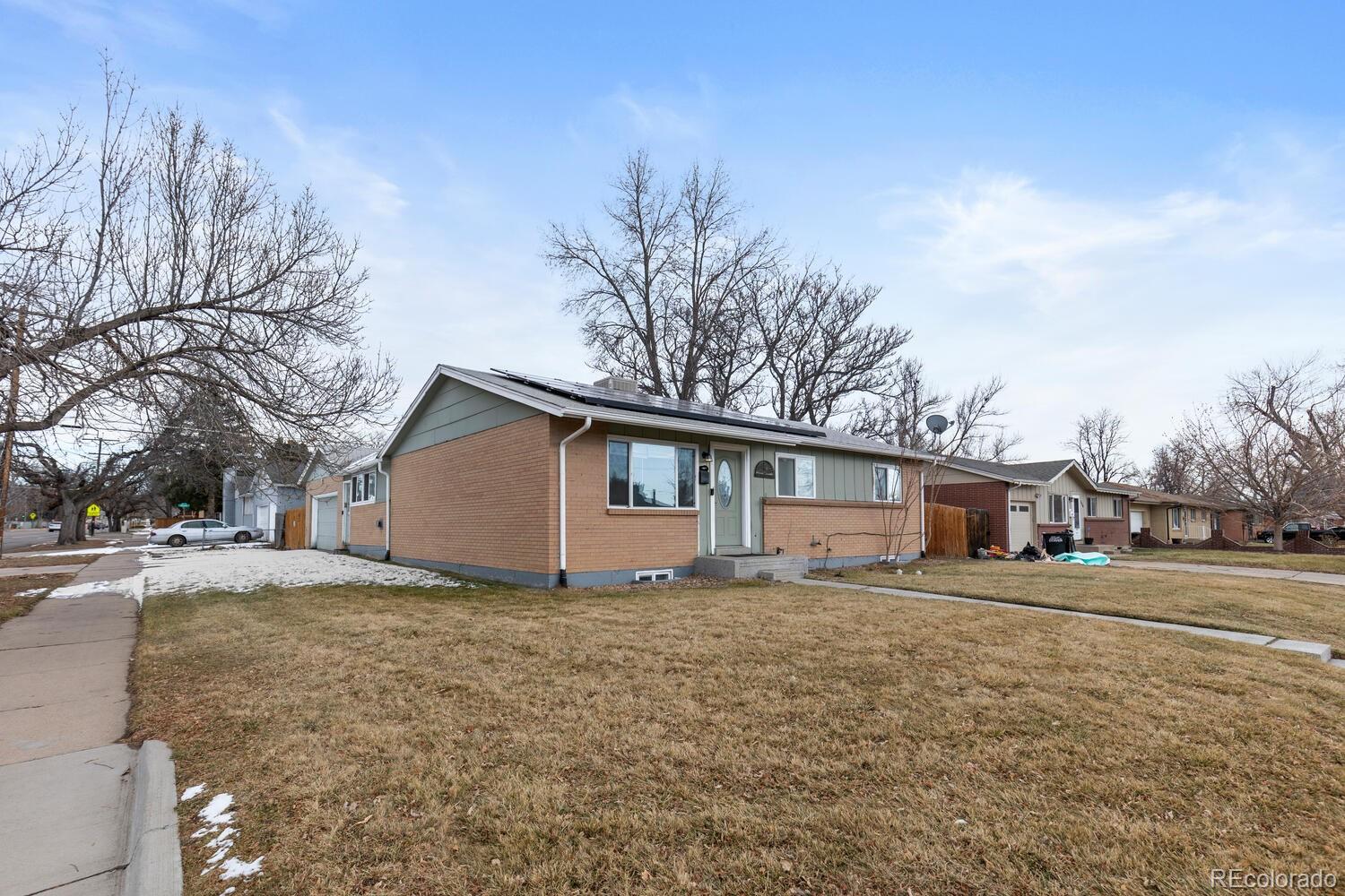 3106 South Wolff Street Denver, CO 80236 - Photo 4 of 48 a house with a outdoor space