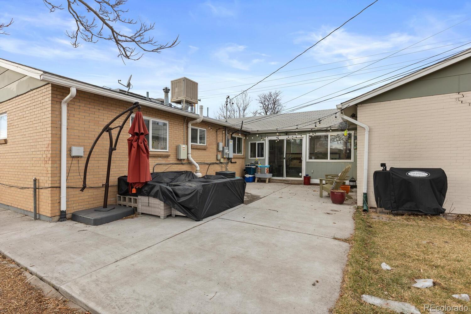 3106 South Wolff Street Denver, CO 80236 - Photo 44 of 48 a view of a porch with furniture and a tv