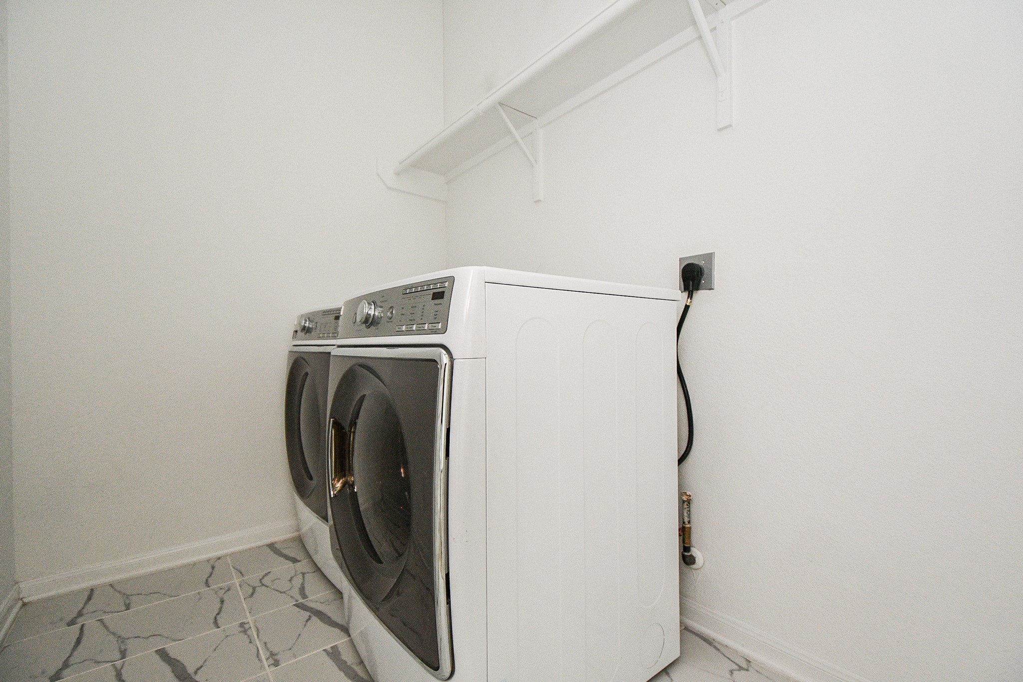 8215 Longear Lane Rosenberg, TX 77469 - Photo 11 of 23 Washer and Dryer Included inside the home