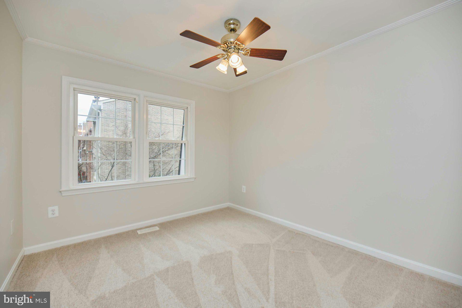 9007 O'Keith Court Springfield, VA 22152 - Photo 19 of 39 a view of an empty room with a window