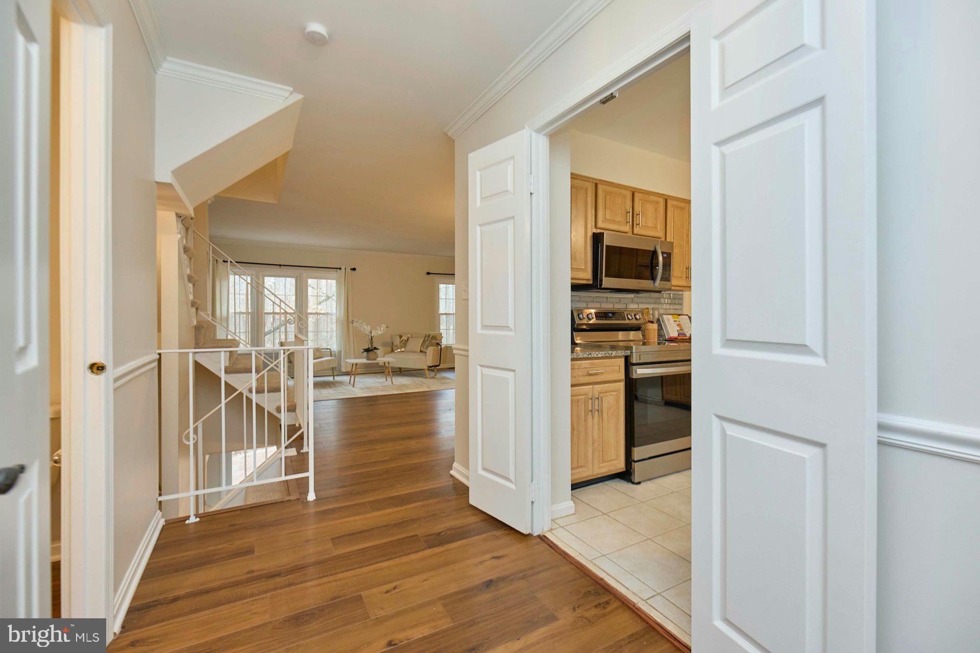9007 O'Keith Court Springfield, VA 22152 - Photo 2 of 39 a view of a kitchen from the hallway