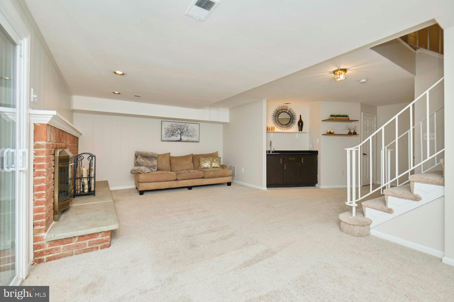 9007 O'Keith Court Springfield, VA 22152 - Photo 24 of 39 a view of livingroom with furniture and fireplace