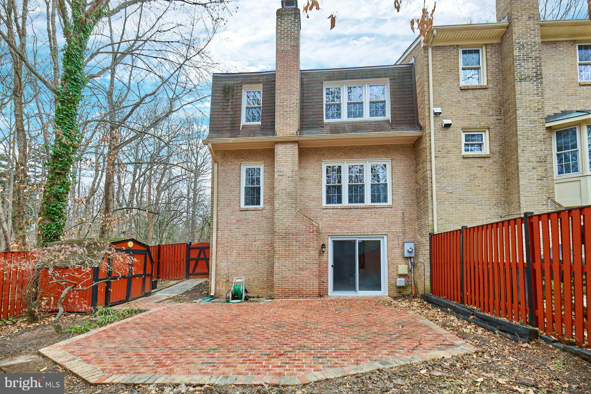 9007 O'Keith Court Springfield, VA 22152 - Photo 31 of 39 a backyard of a house with barbeque oven and outdoor seating