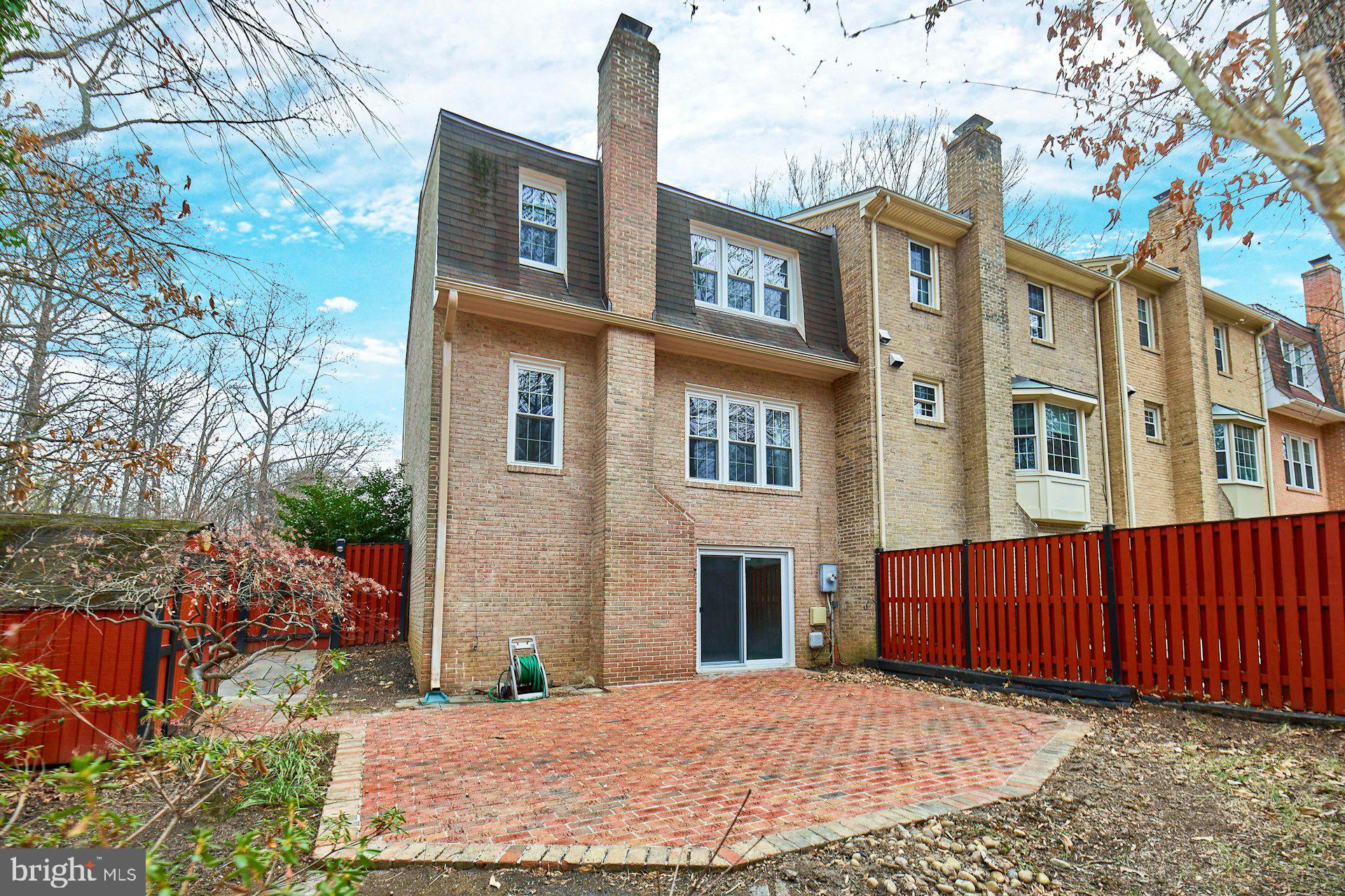 9007 O'Keith Court Springfield, VA 22152 - Photo 32 of 39 a view of a brick building with many windows