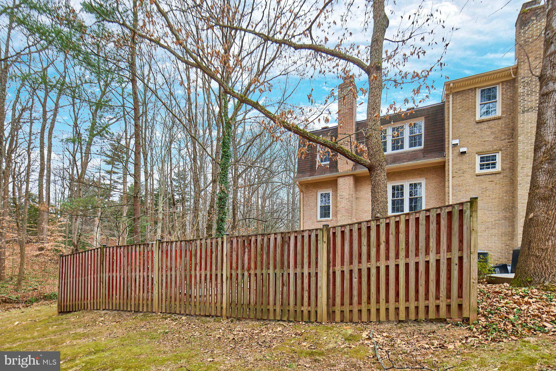9007 O'Keith Court Springfield, VA 22152 - Photo 34 of 39 a front view of a house with a fence