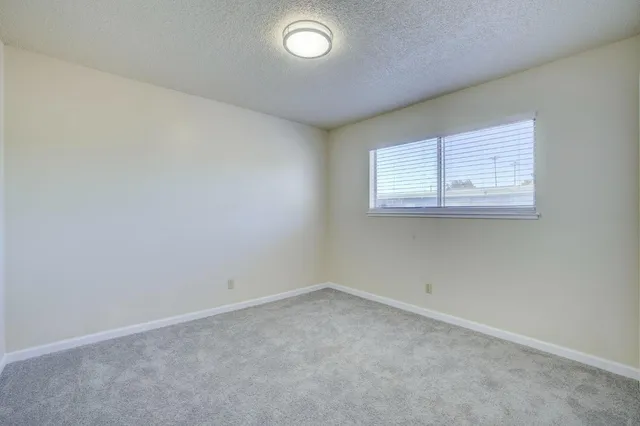 a bathroom with a sink toilet vanity and shower