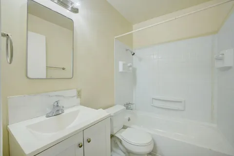 a view of an empty room and closet area