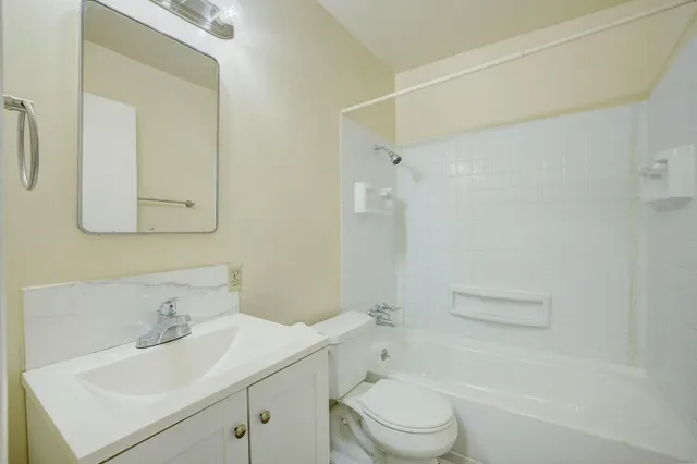 a view of an empty room and closet area