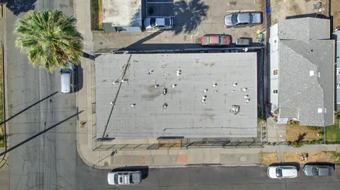 an aerial view of a house with swimming pool