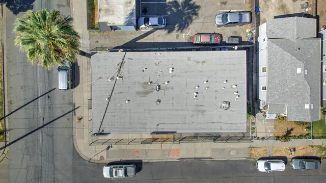 an aerial view of a house with swimming pool