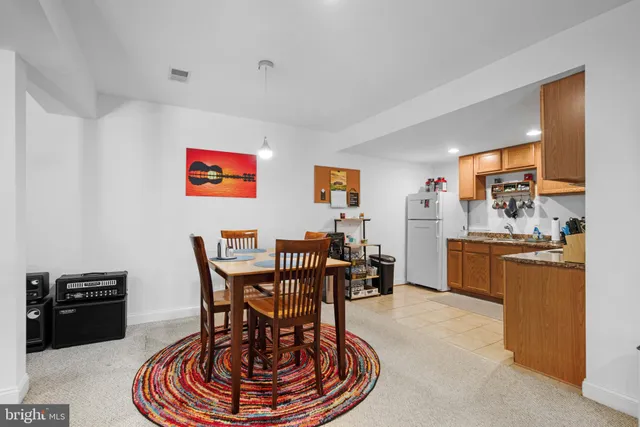 a living room with furniture and next to a window