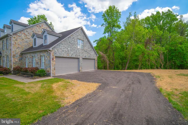 a view of a house with pool and yard