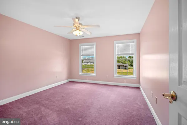 a view of an empty room with stairs