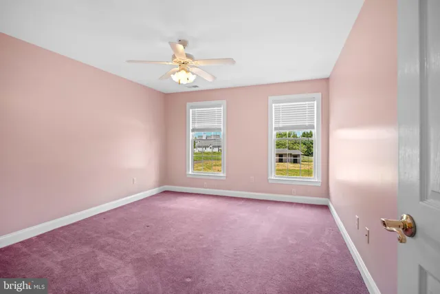 a view of an empty room with stairs