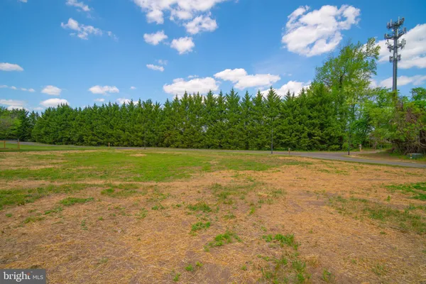 a kitchen with granite countertop a stove sink and refrigerator