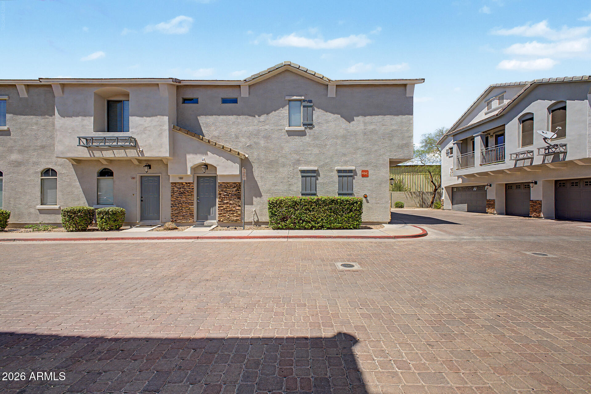 2150 East Bell Road, Unit 1089 Phoenix, AZ 85022 - Photo 1 of 20 front view of a house with a street