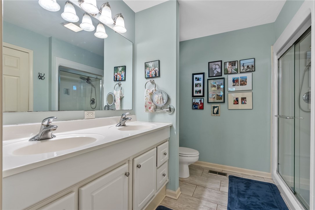 3513 Hopewell Road Anderson, SC 29621 - Photo 12 of 50 Dual vanity sinks provide ample space in this well-appointed bathroom, featuring a convenient walk-in shower.