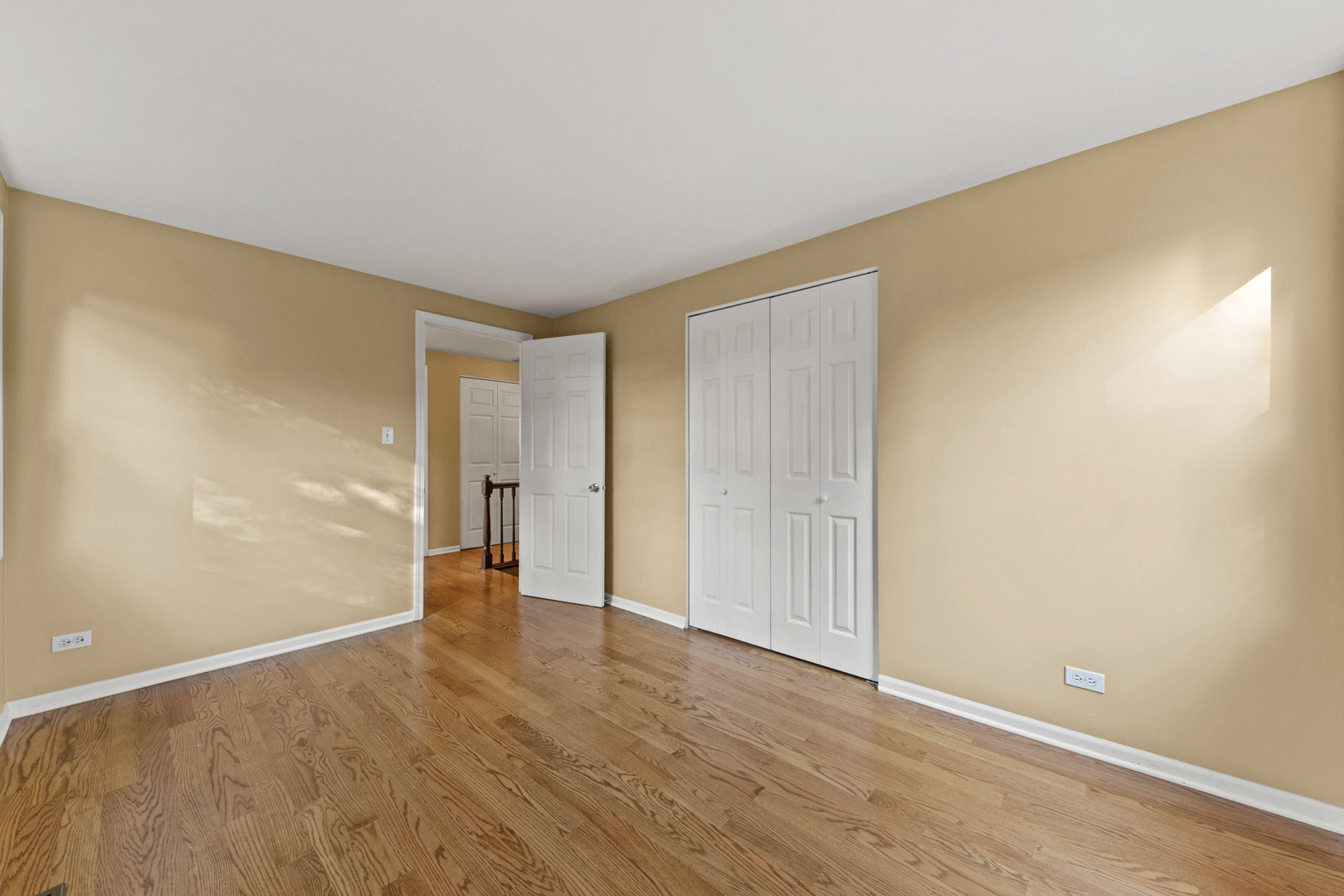 1121 Belmar Lane Buffalo Grove, IL 60089 - Photo 17 of 22 a view of an empty room with wooden floor
