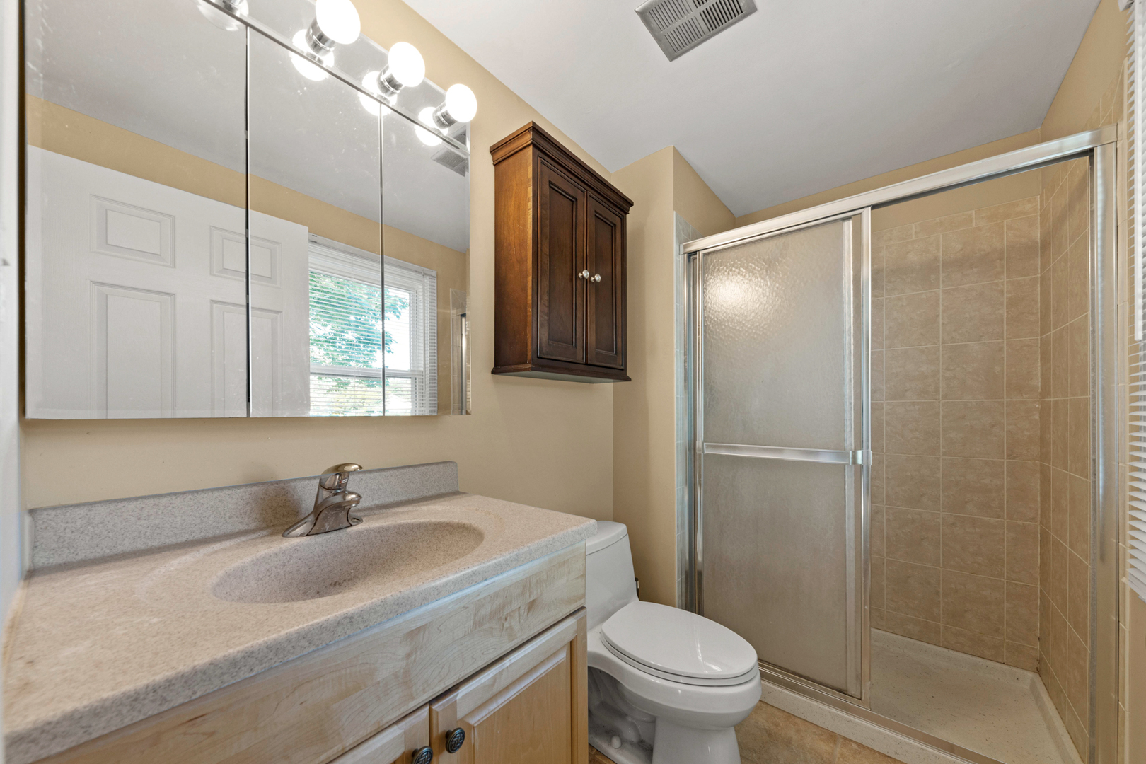 1121 Belmar Lane Buffalo Grove, IL 60089 - Photo 21 of 22 a bathroom with a sink toilet and shower