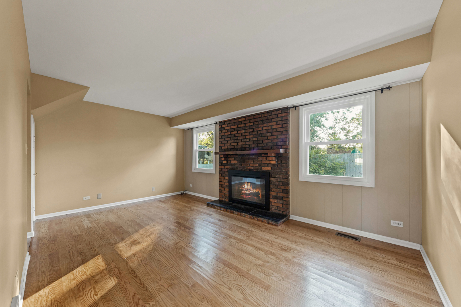 1121 Belmar Lane Buffalo Grove, IL 60089 - Photo 9 of 22 a view of an empty room with window and fire place