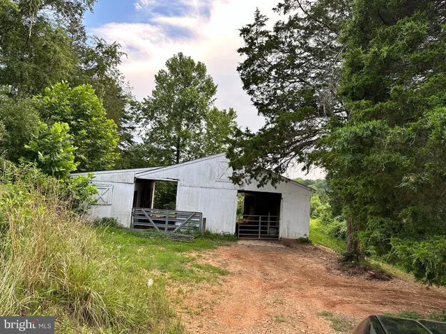a view of a patio with a small yard