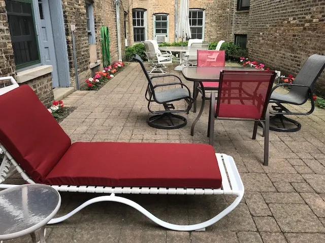 a view of a chairs and table in the patio