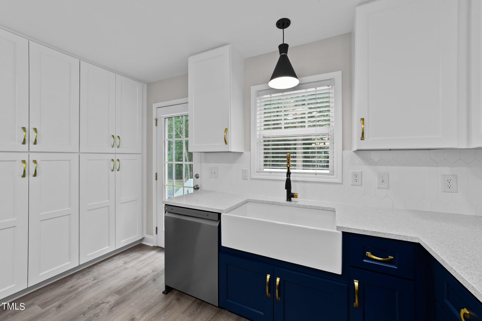 2713 Rustic Brick Road Raleigh, NC 27603 - Photo 17 of 53 a kitchen with a sink and a window