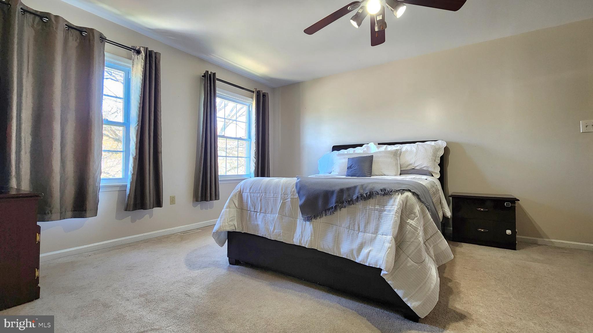 46 Currant Drive Newark, DE 19702 - Photo 29 of 47 a spacious bedroom with a bed and a chandelier