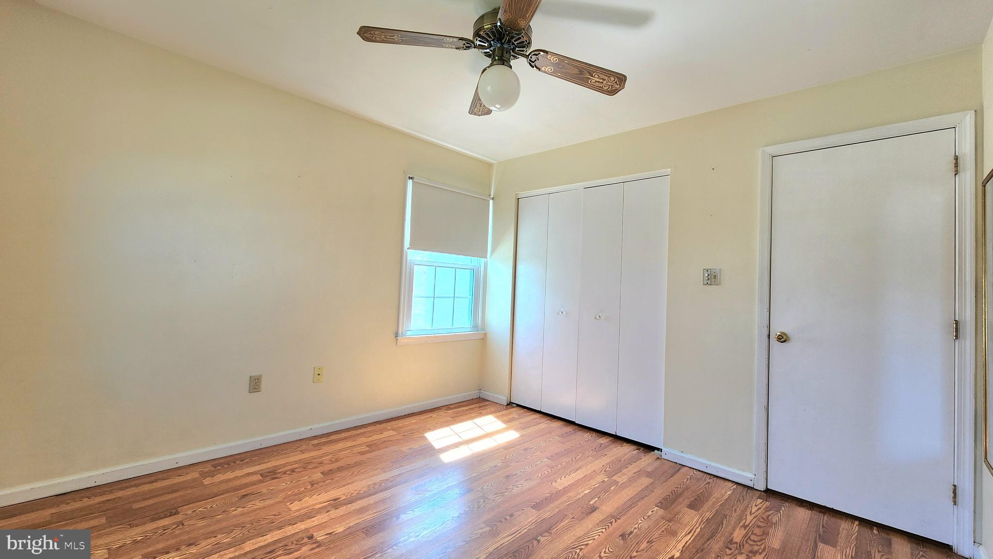 46 Currant Drive Newark, DE 19702 - Photo 43 of 47 a view of empty room with wooden floor and fan