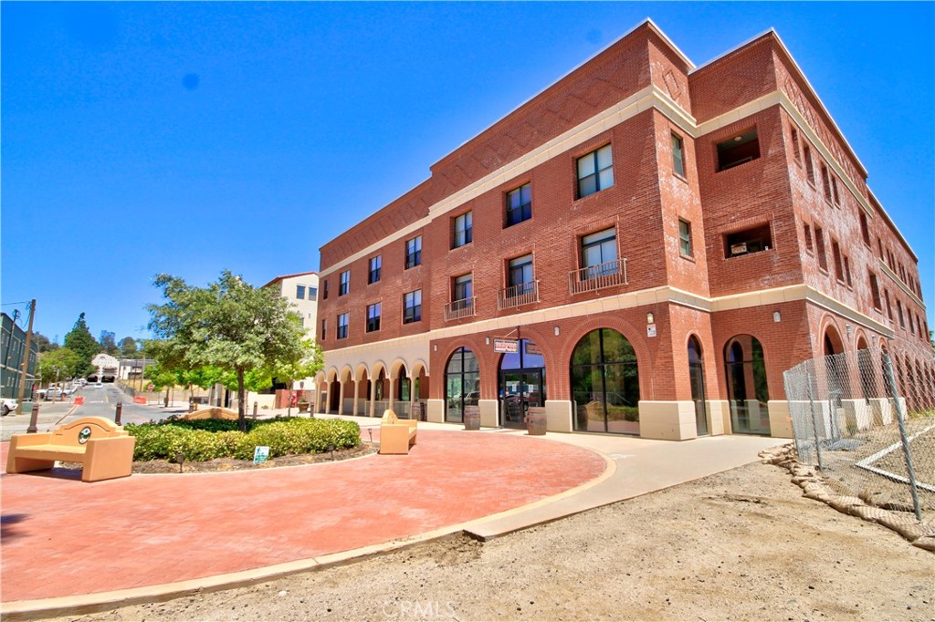42081 3rd Street, Unit 213 Temecula, CA 92590 - Photo 1 of 1 front view of a building with a yard