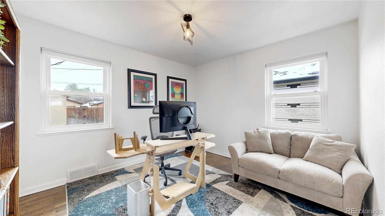 3155 Steele Street Denver, CO 80205 - Photo 16 of 37 a living room with furniture and a window