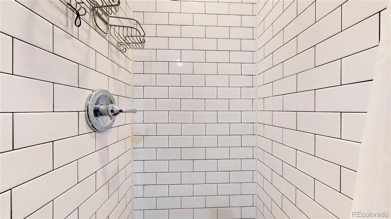 3155 Steele Street Denver, CO 80205 - Photo 22 of 37 a bathroom with a shower