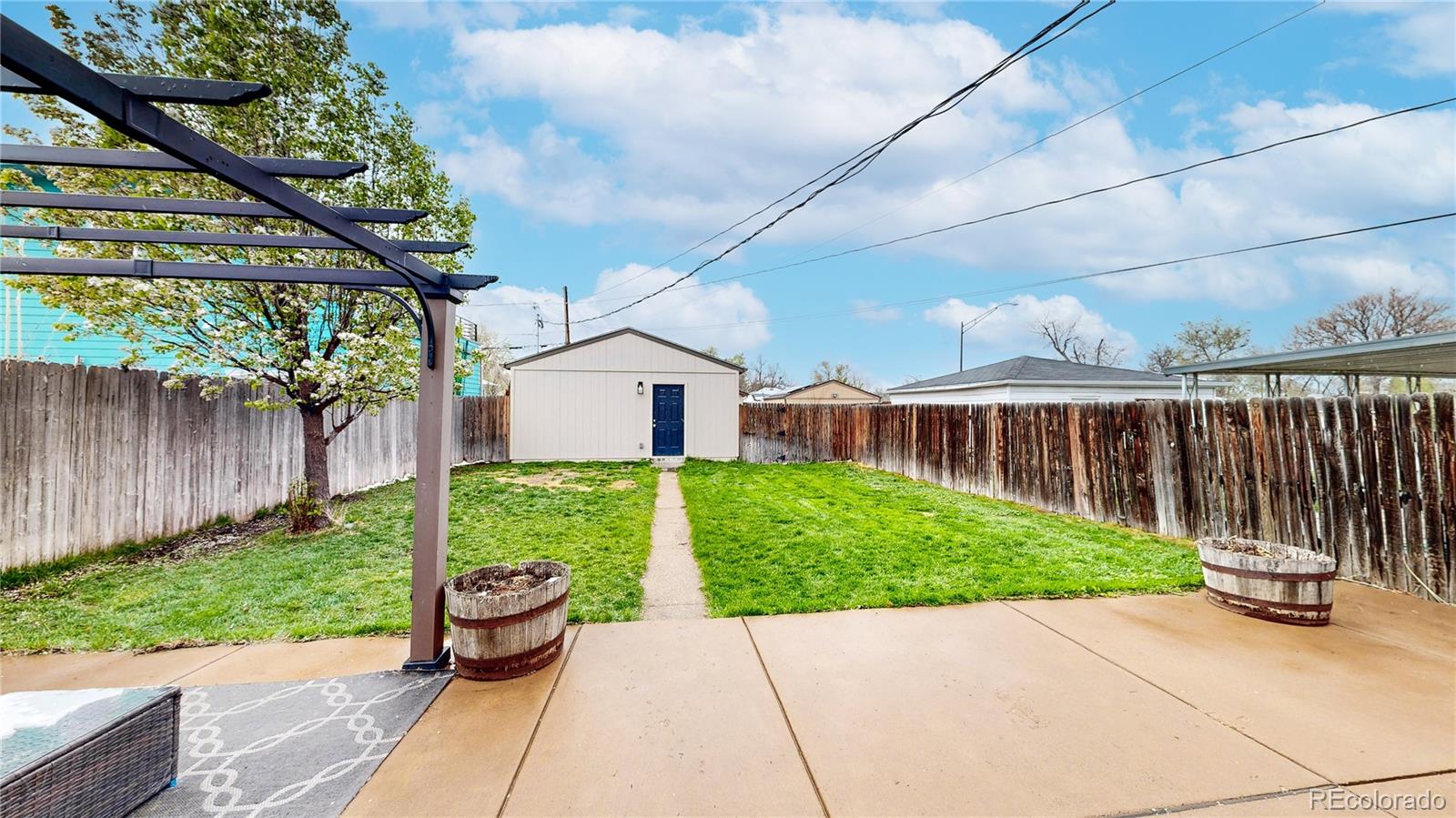 3155 Steele Street Denver, CO 80205 - Photo 23 of 37 a view of a back yard with a patio