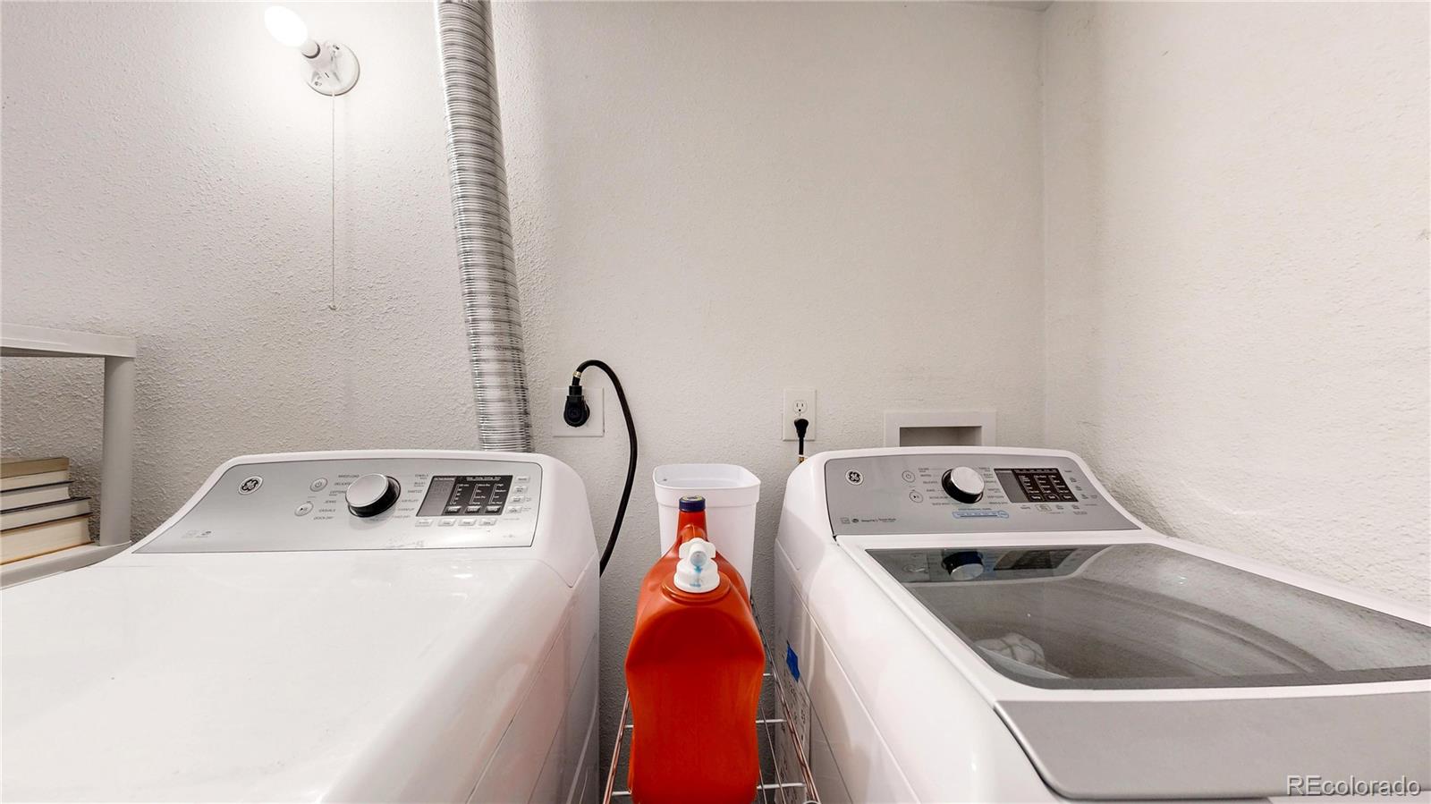 3155 Steele Street Denver, CO 80205 - Photo 31 of 37 a utility room with dryer and washer