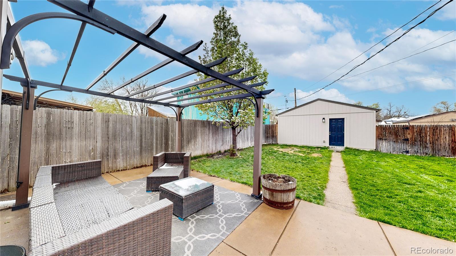 3155 Steele Street Denver, CO 80205 - Photo 32 of 37 a garden view with a seating space