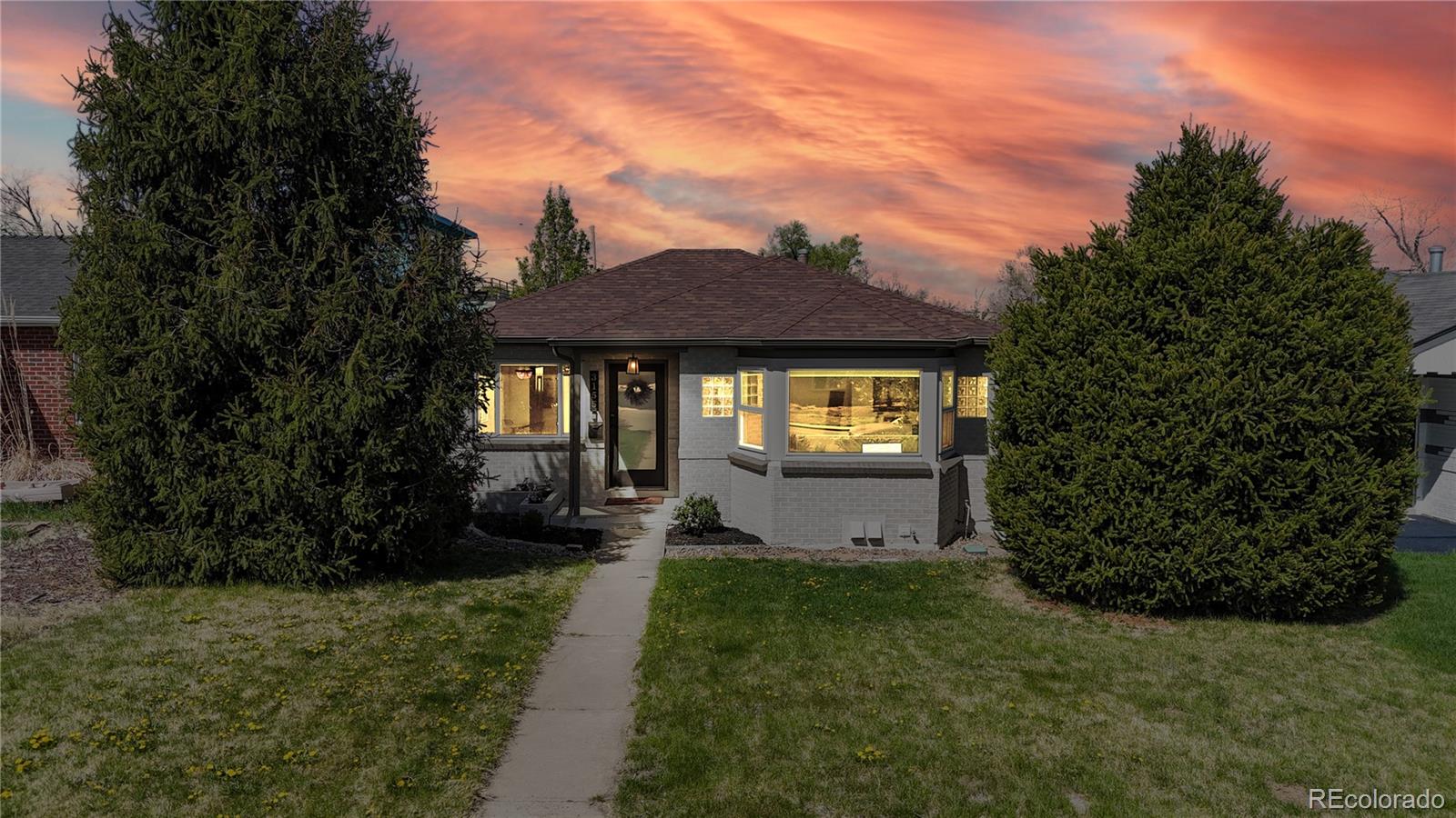 3155 Steele Street Denver, CO 80205 - Photo 33 of 37 a front view of a house with garden