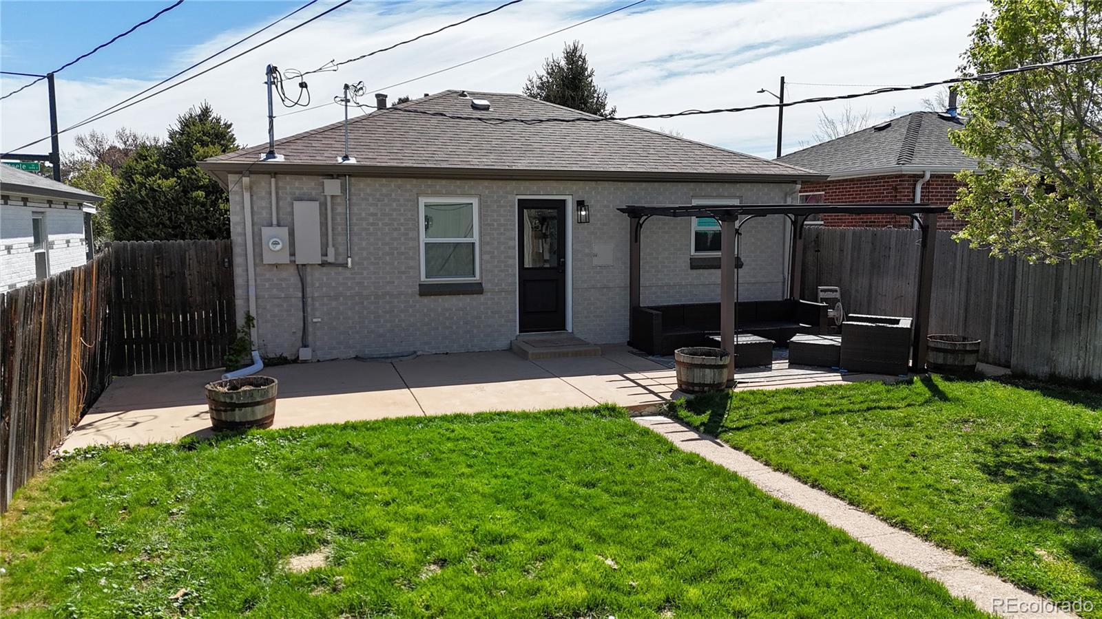 3155 Steele Street Denver, CO 80205 - Photo 35 of 37 a view of a chair and table in backyard of the house
