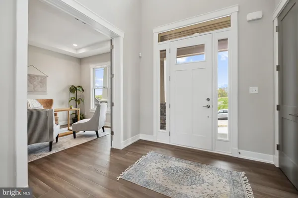 a view of a livingroom view with wooden floor and a couch