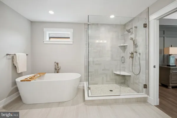 a bathroom with a shower and a bathtub