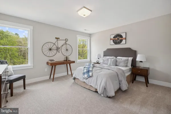 a bedroom with a bed and a table