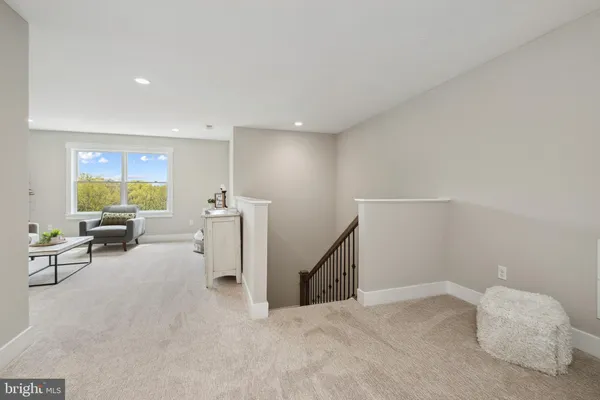 a view of a livingroom with entryway and furniture